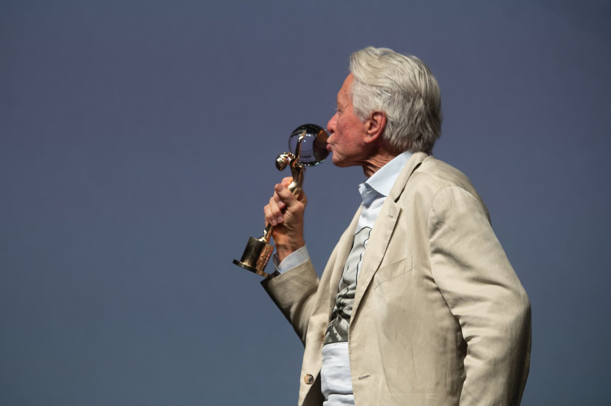 KVIFF's tweet photo. Michael Douglas as the star guest of #KVIFF59! Before the screening of the film One Flew Over the Cuckoo's Nest, Kryštof Mucha presented him with a newly designed Crystal Globe – a replacement for the original award from 1998, which Jiří Bartoška jokingly referred to as a "wafer" https://t.co/kQRwjnnzTw