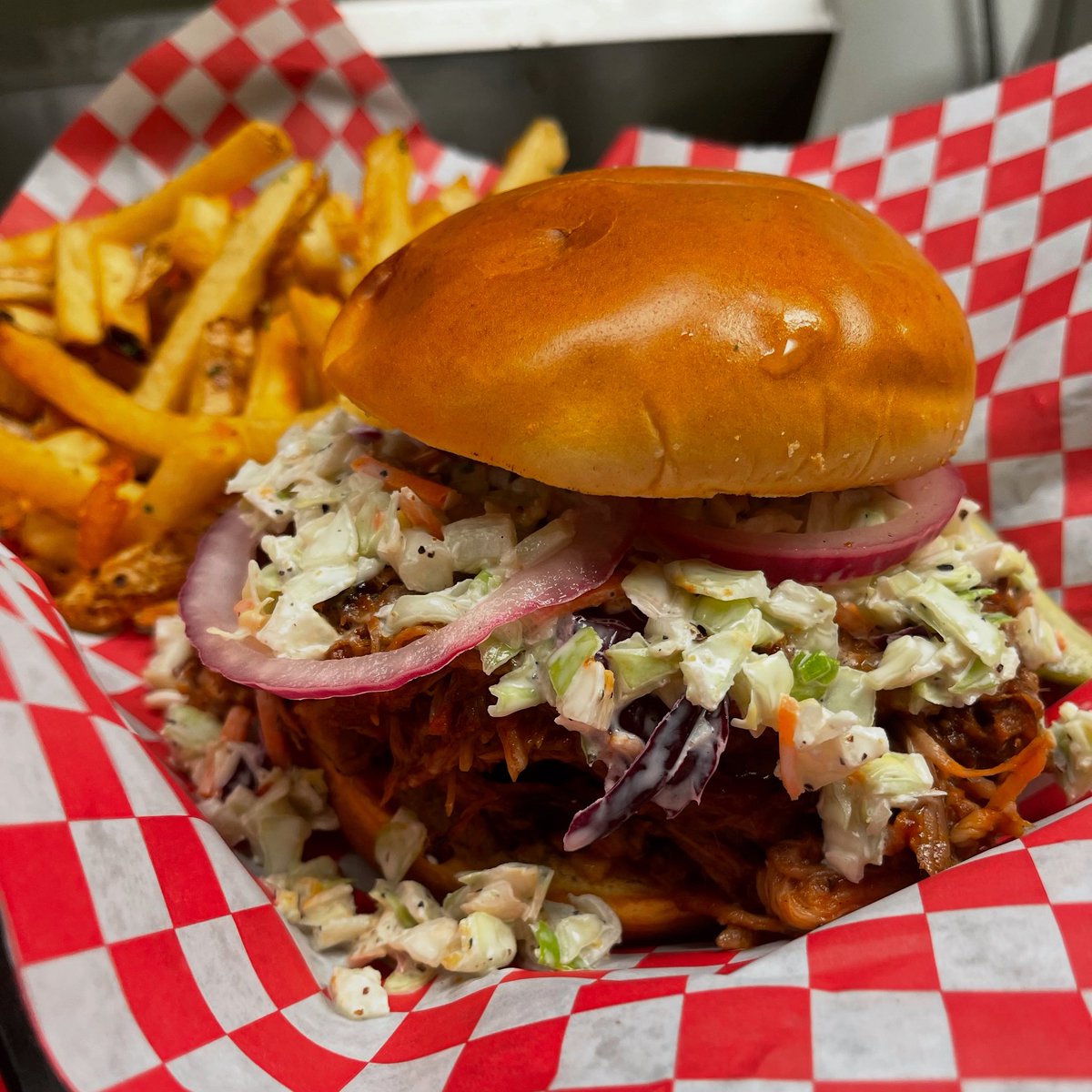 One of our July specials, this is the Piggly Wiggly Sandwich.  Made with slow cooked pulled pork, slaw, picketed onions and loganberry bbq sauce.   Available all month at our Paradise location.