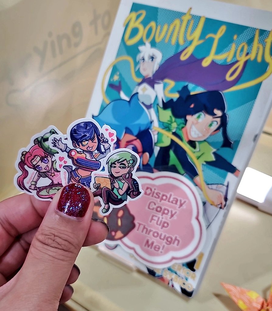 I'm fresh out of Shadowlord stickers, but I still have Hero Hime, Monique and Textbox-chan at AA B59!! And if you liked my work with Shadowlord, check out my comic Bounty Light! You might understand better why I was chosen to write him~