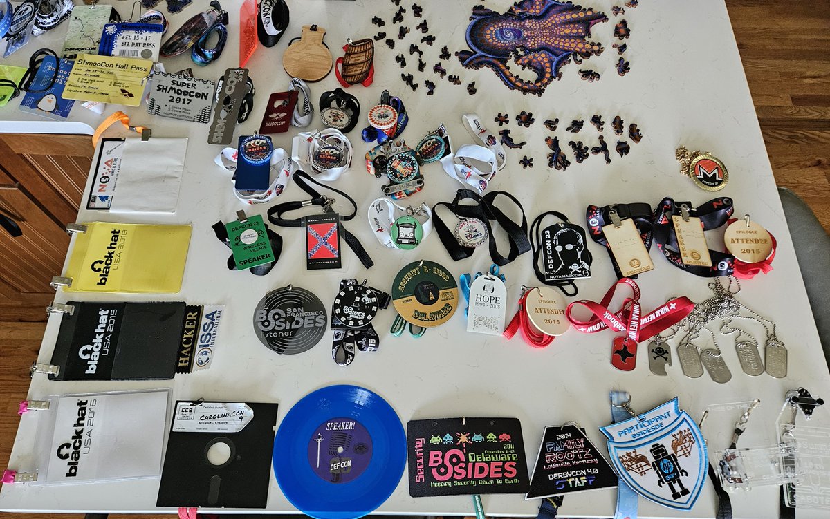 attritionorg's tweet photo. The badges for the upcoming charity auctions are photographed and sorted! Next up, inventory w/ details then list them... #DEFCON #DerbyCon #ShmooCon #BadgeLife https://t.co/zUY5QYKwM6