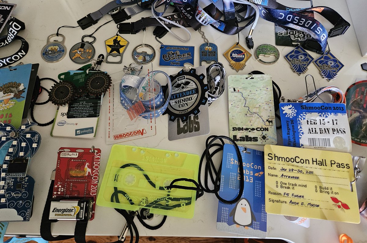 attritionorg's tweet photo. The badges for the upcoming charity auctions are photographed and sorted! Next up, inventory w/ details then list them... #DEFCON #DerbyCon #ShmooCon #BadgeLife https://t.co/zUY5QYKwM6