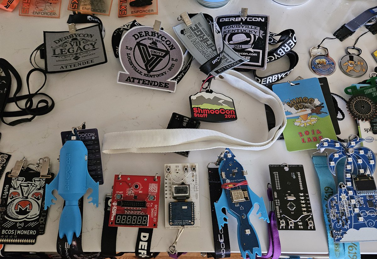 attritionorg's tweet photo. The badges for the upcoming charity auctions are photographed and sorted! Next up, inventory w/ details then list them... #DEFCON #DerbyCon #ShmooCon #BadgeLife https://t.co/zUY5QYKwM6