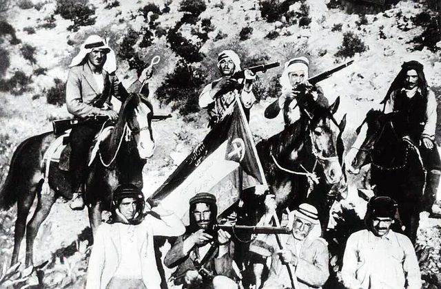 A picture of Palestinian rebels from the 1930s, with the Palestinian flag that was invented in 1964 by the KGB or something. 
This flag has a crescent and cross added, to demonstrate the unity of Palestinian Christians and Muslims against the British and their Zionist project.