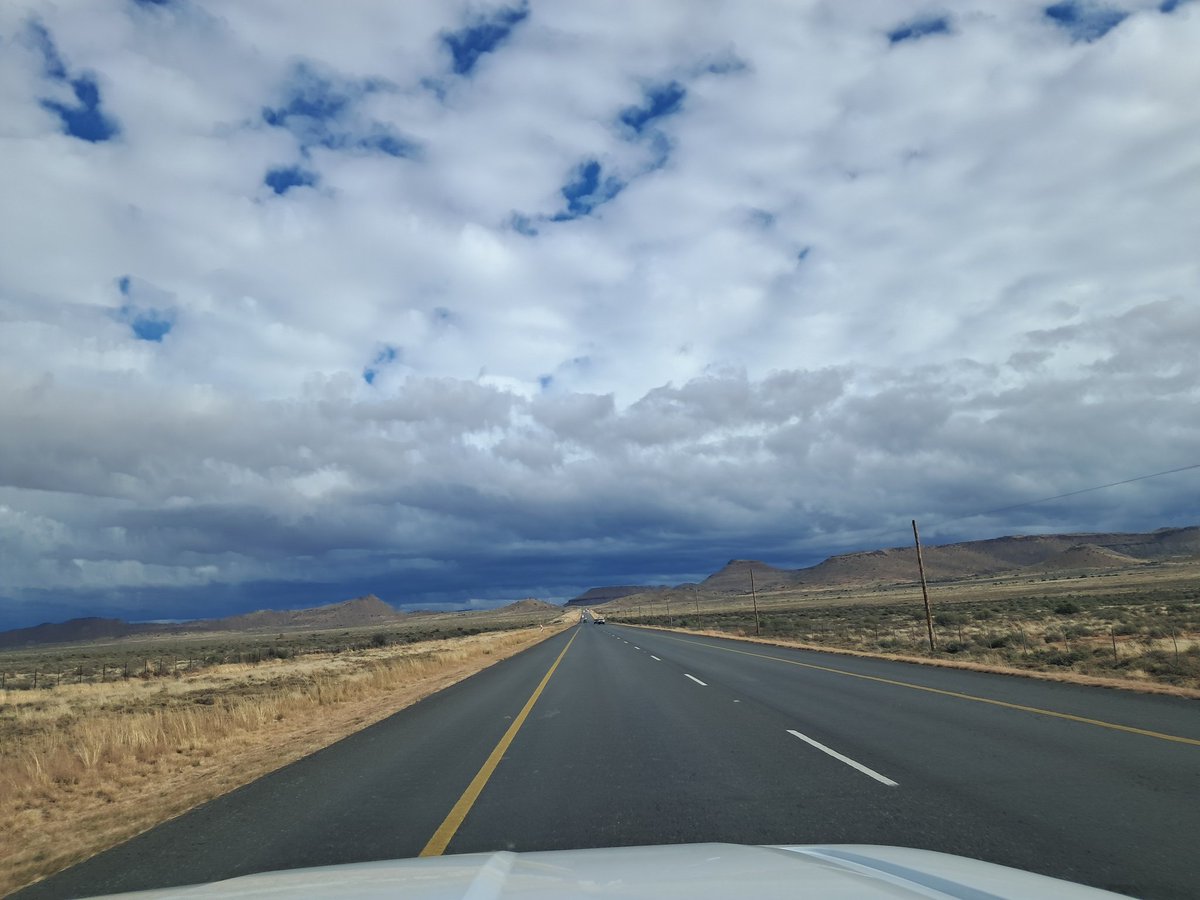 hugopien's tweet image. Driving back to Cape Town from Joburg yesterday, the Northern Cape landscape with dark winter clouds above it was spectacular. It was cold outside the entire way.