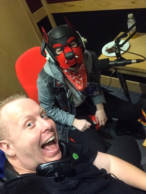 This is a picture of child rapist Stephen Ireland volunteering to teach how to work on radio shows at a school ... with a child in fetish gear. Here's a thread on the responses women who raised alarms about the Pride in Surrey founder received 1/3