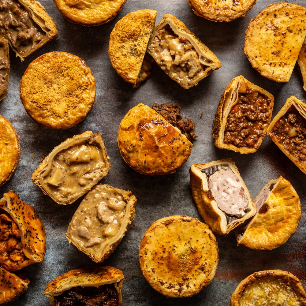 Why settle for one flavour when you can try four? Our July assortment box includes a rotating selection of handcrafted pies—this month, enjoy:
- Butter Chicken
- Chicken, Ham &amp; Leek
- Beef &amp; Potato
- Cauliflower Cheese