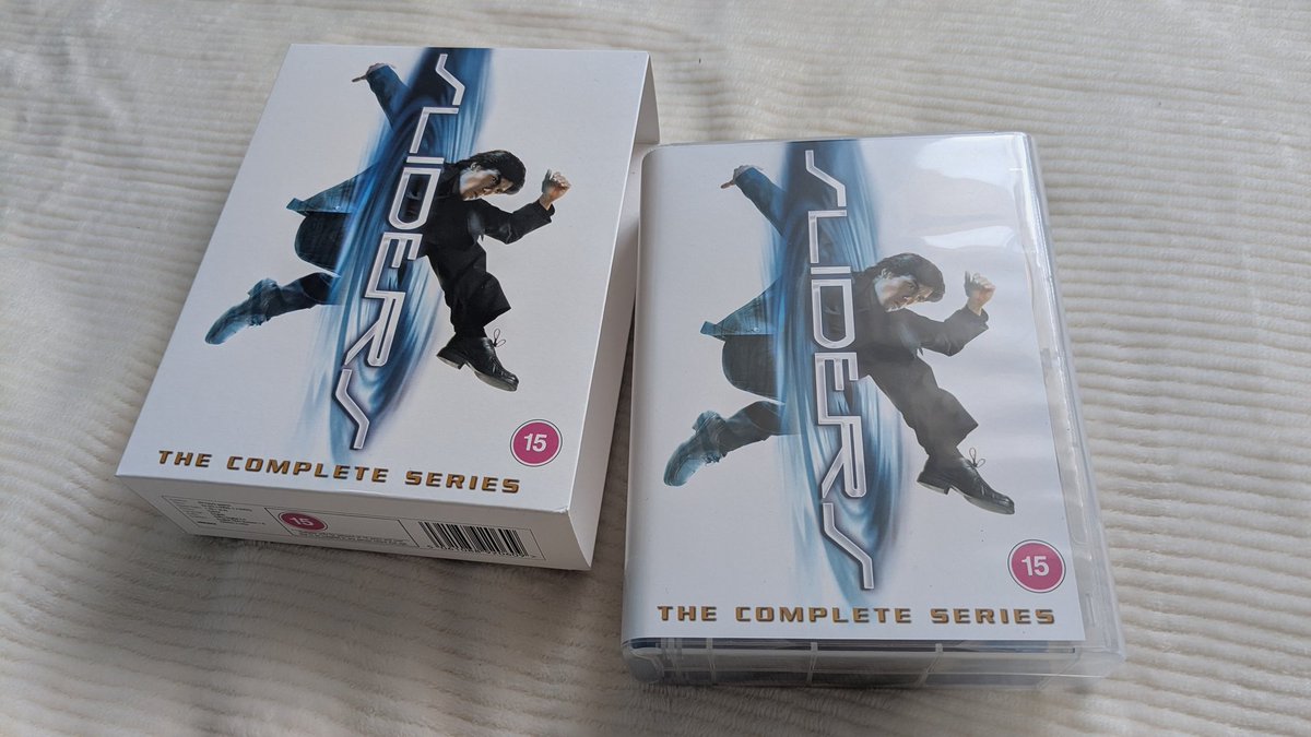 Sliders: The Complete Series, the first full UK release of all five seasons on DVD, has arrived. Unfortunately, the box is significantly different from the US release, where each season was packed into a separate box. Here, all 24 discs are packed into a large box.

#sliders