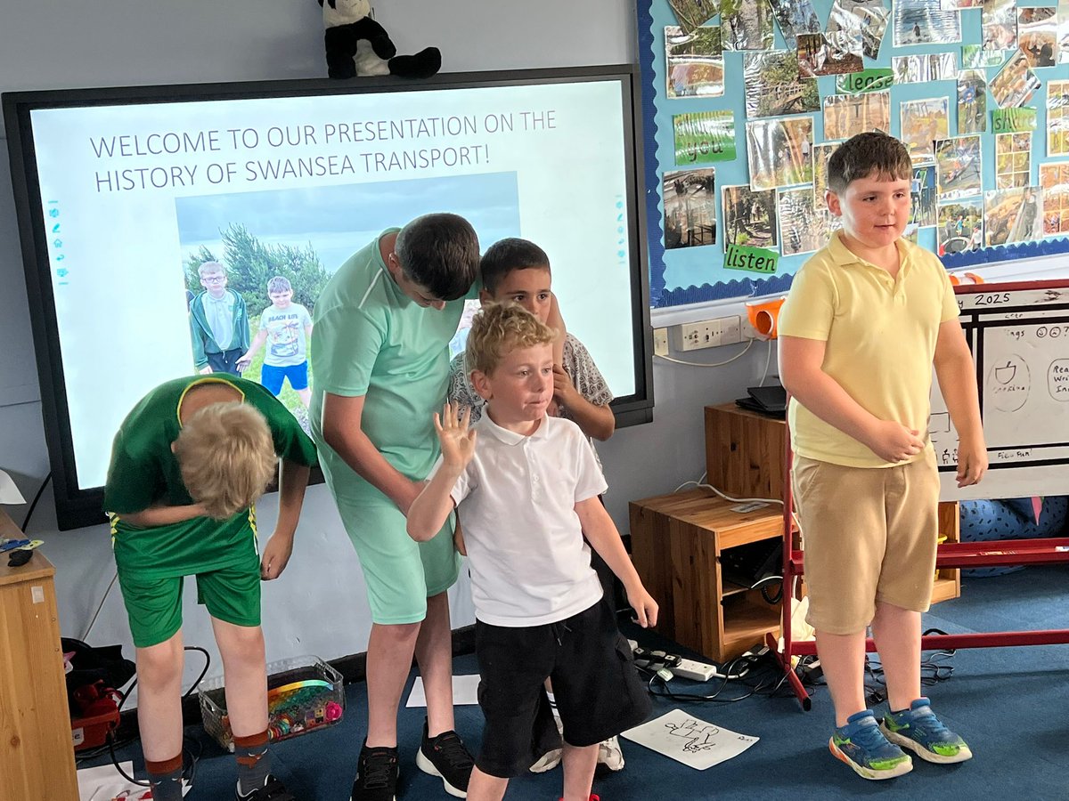 The photo shows the pupils of The Bridge taking the applause after presenting what they have learnt about the history of transport in Swansea. They made a PowerPoint about coal mining, the canals, Swansea Docks and The famous Mumbles Train. Well done boys!