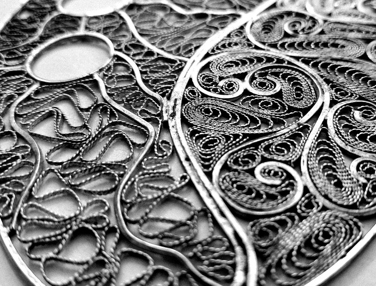 Like hidden pathways in a forgotten city,
each twist of silver tells a story.
Where tradition coils into modern breath,
and the past dances with the present.
This is filigree - delicate yet defiant,
a map of memory etched in metal.
#FiligreeArt #markborg #malta #maltese #filigree