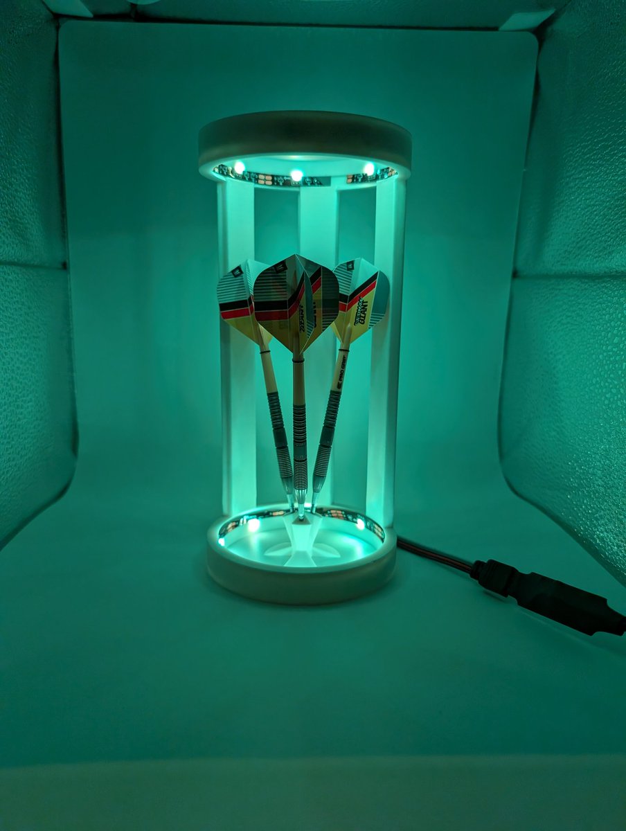 Looks better with a white print I think. 

Light is more reflective and bounces around better.