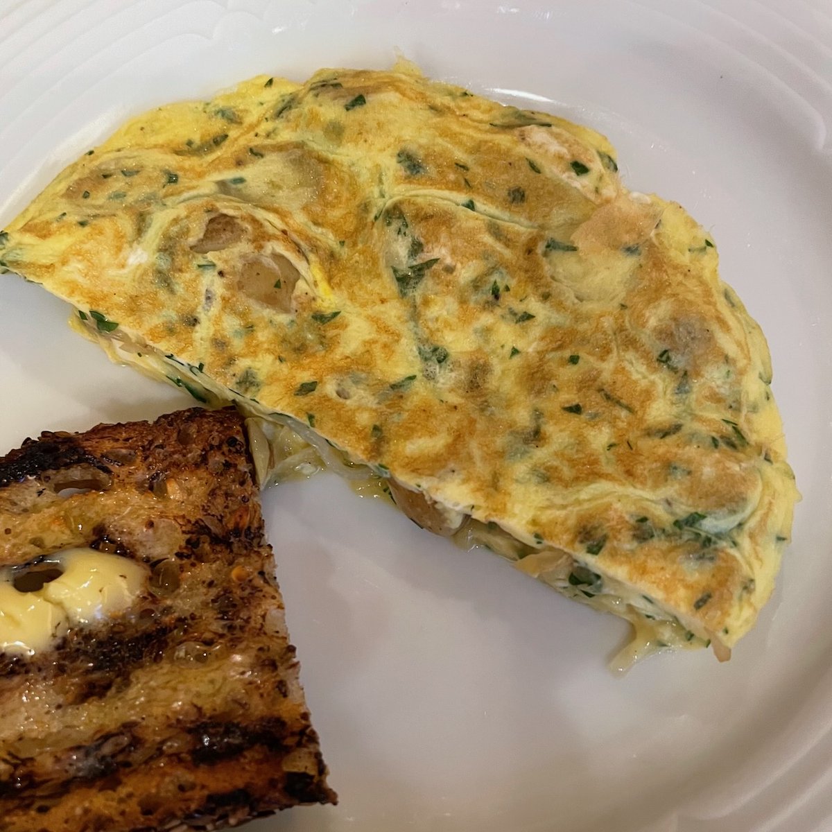 For some of the afternoon, the house was perfumed by a batch of confit pork belly. Enticing, but when it was time to decide on dinner, something milder seemed necessary: a frittata of new fingerling potatoes and new onions, with delicious, well-grilled bread and plenty of butter.