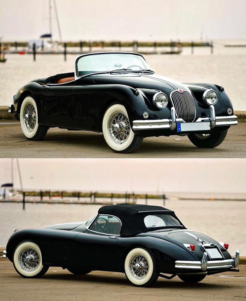 The whitewall tires contrast beautifully against the deep gloss black finish of the XK150.