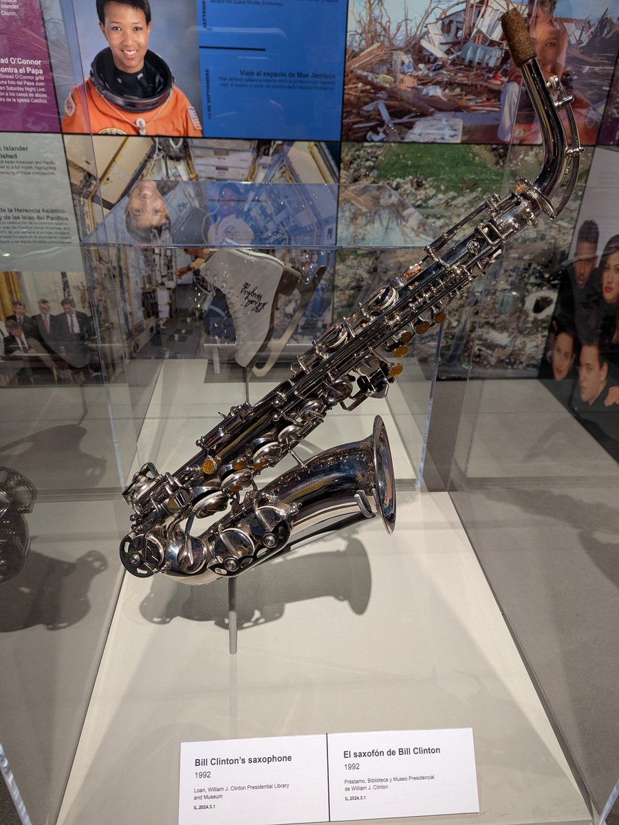 BrentHBaker's tweet image. Some fun things at History Colorado Center. John Denver's guitar, Bill Clinton's saxophone, noting Avalanche as 1996 Stanley Cup champions, home of the 1990s with an Iran-Contra/Oliver North Time mag.