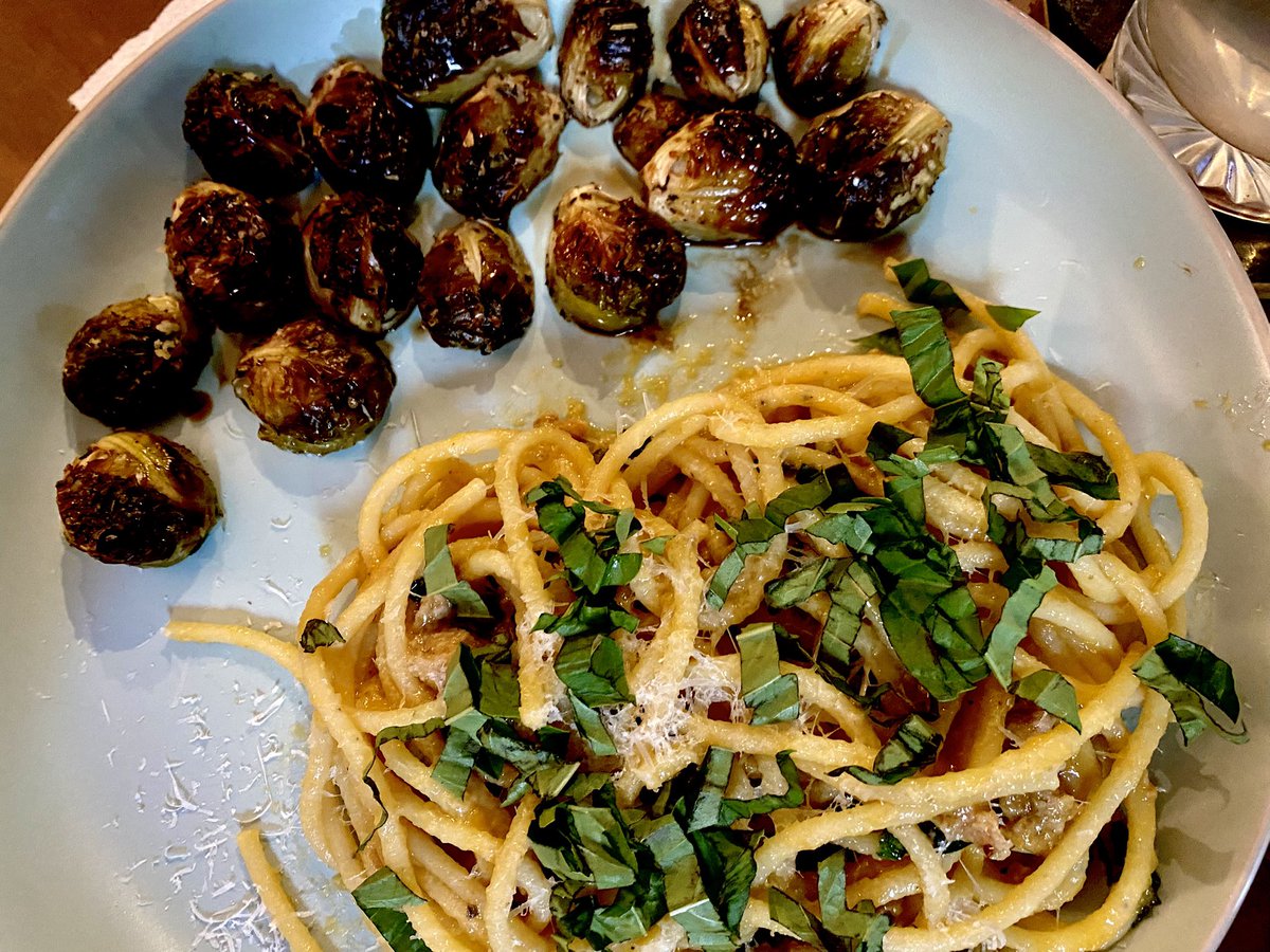 Sunday dinner: pici pasta in yellow tomato sauce and truffle sausage, brussels sprouts with balsamic