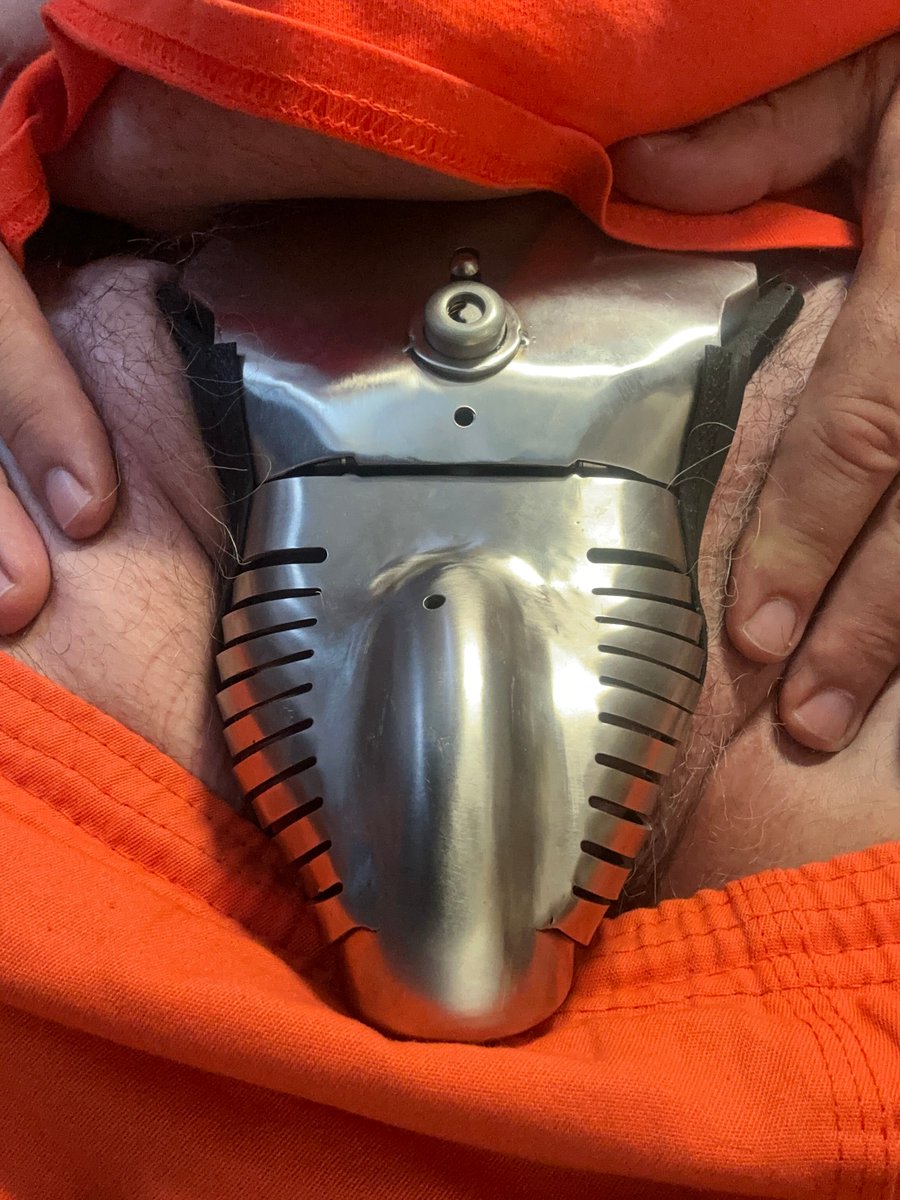 Still locked. Still waiting. The Carrara belt hasn’t shifted a single millimeter. It doesn’t have to.  It just is—constant, present, absolute. But today, something changed. A  shadow moved at the door. Was it inspection? Interest? A test? was just a reminder?  I’m not invisible.