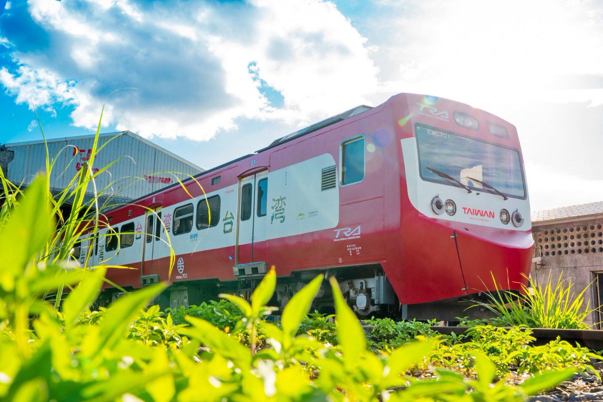 Taiwan_Today's tweet photo. An EMU700 train featuring #Taiwan🇹🇼 agricultural product decals and the red livery of trains operated by #Japan’s🇯🇵 Keikyu Corp. is launched July 4 at Shulin Station in New Taipei City. The train will run on Taiwan Railway Corp.’s #Yilan line for the next six months to promote tourism in northeastern Taiwan. (Courtesy of Tourism Administration)
