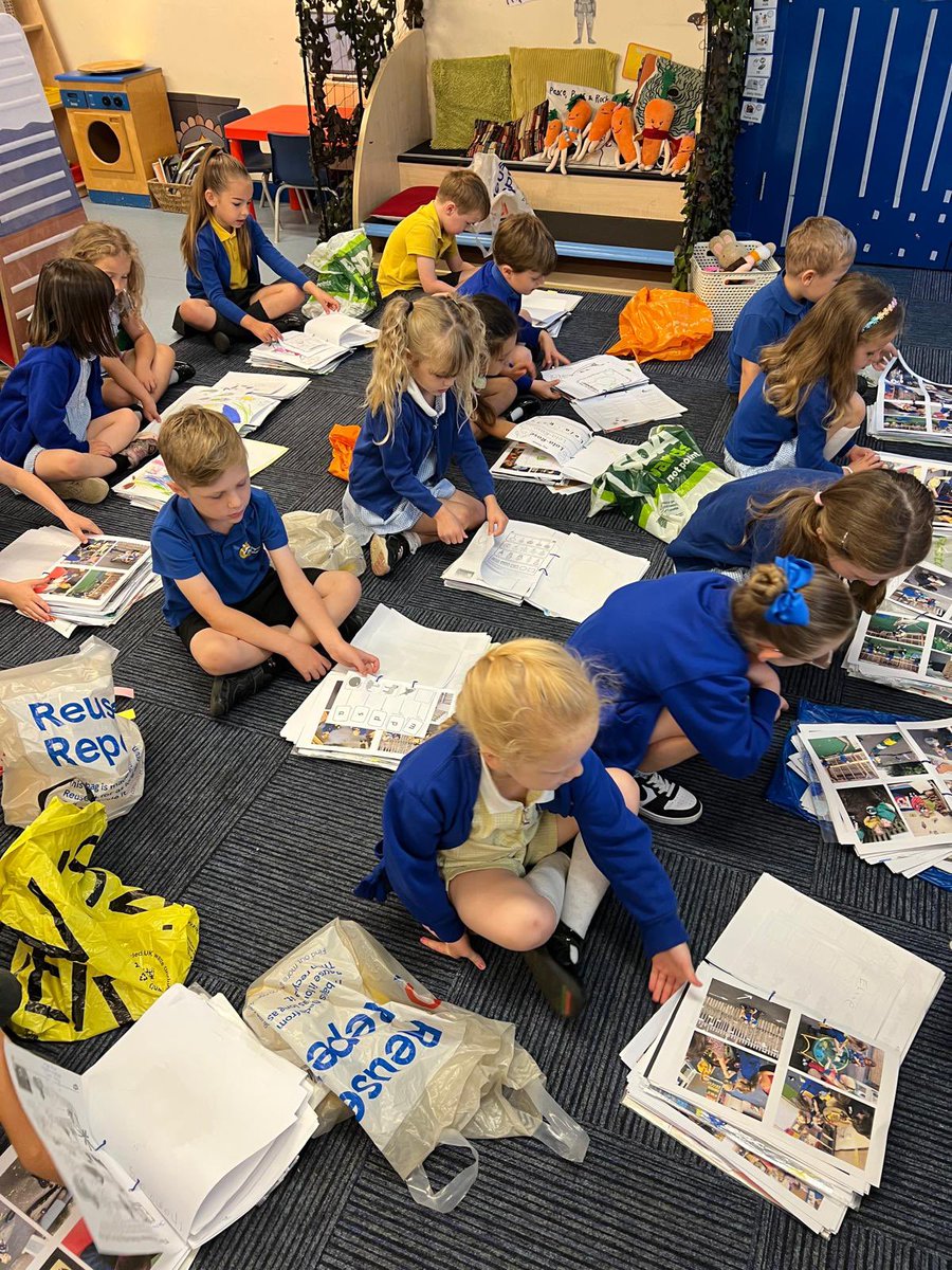 Foundation stage enjoying looking through all their work from the year!