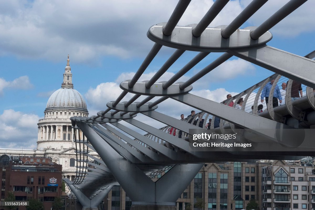 The London Millennium Footbridge over the River Thames, designed by Norman Foster and completed in 2000. Famous for having been wobbly and making pedestrians 'seasick', before repairs were later made. (2010)