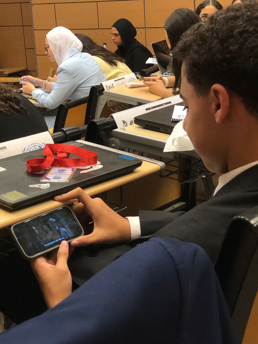 It seems that the delegate of Malaysia is having fun watching movies.
<a href="/nimunpress/">NIMUN PRESS</a> #ODC HH