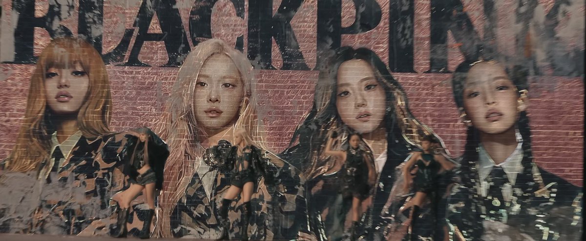 BLACKPINK STANDING RIGHT IN FRONT OF THEIR BILLBOARD