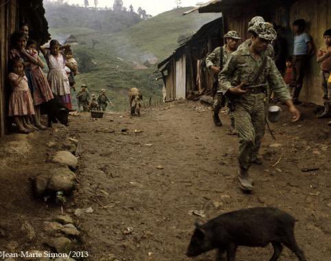 In retaliation for the lynching of Guatemalan landlord José Luis Arenas one month ago today, the Guatemalan Army lands helicopters in the marketplace of Ixcán, seizes 30 civilian men, loads them in the helicopters, and then, to the town’s horror, pushes them out over the jungle.