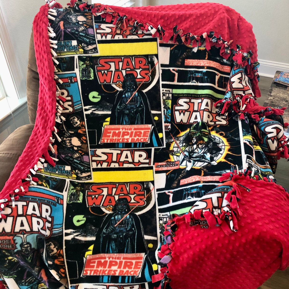 EmpireToJedi's tweet image. Grab your lightsabers, True Believers! Coming Sunday, our extra-long coverage of the EMPIRE STRIKES BACK comic adaptation! I enjoyed re-reading these issues cozy under this blanket made by my wife & daughter! Check out the EMPIRE comic representation! Tune in Sunday! #StarWars