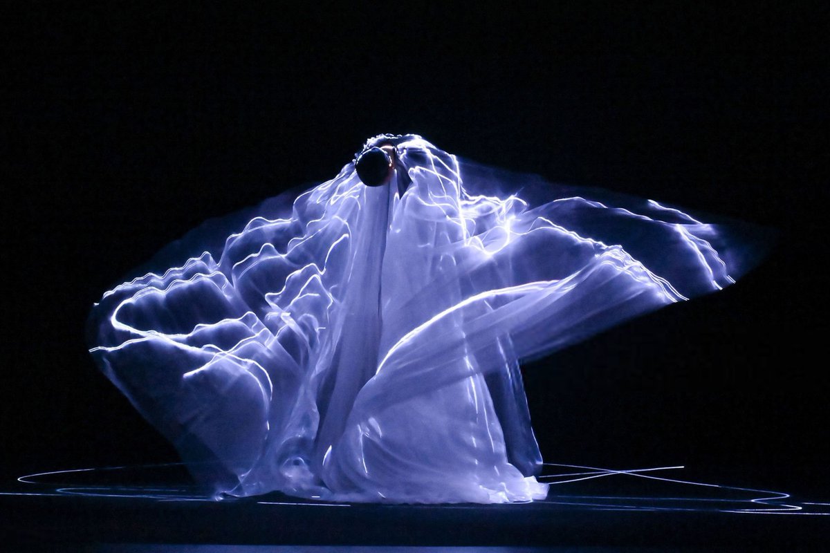 OMG what a view! It looks like she's striking lightning!!