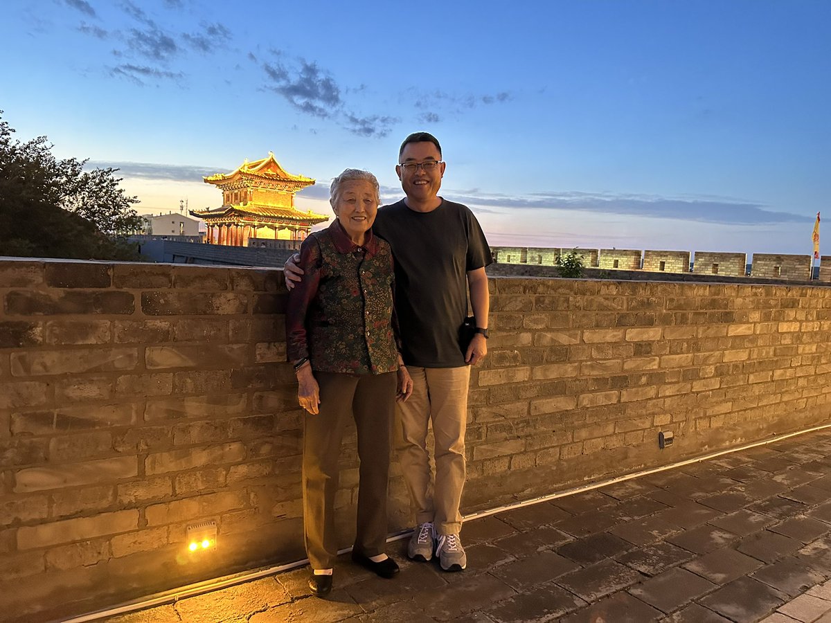 Toured home town city wall with happy mom