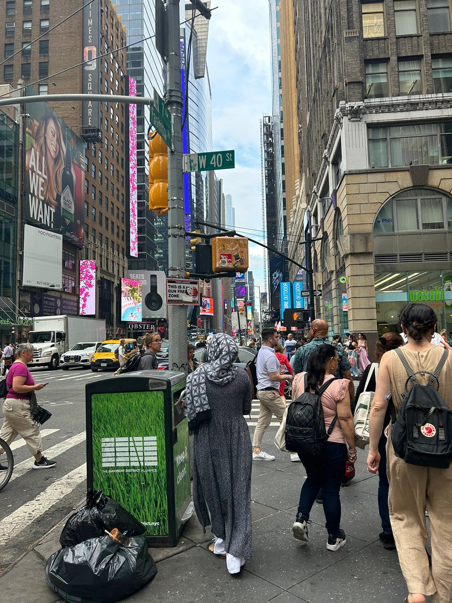 My best friend and I were walking among the crowd. I immediately put on my sun hat