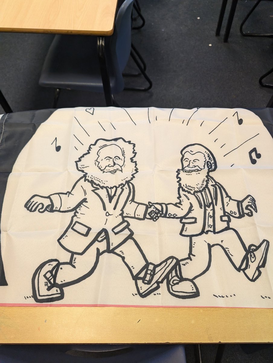 Exactly what every political ideologies teacher wants, a flag of Marx and Engels skipping into the sun together!
