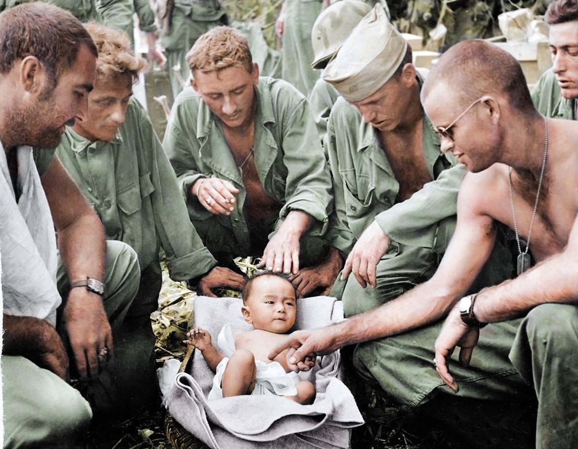 After receiving care for a scalp wound, a Japanese baby is cared for by men a medical unit of the 27th Infantry Division. 🪖

The baby was discovered by a tank crew during the fighting below Mt. Tapotchau on Saipan in July of 1944. 🗻