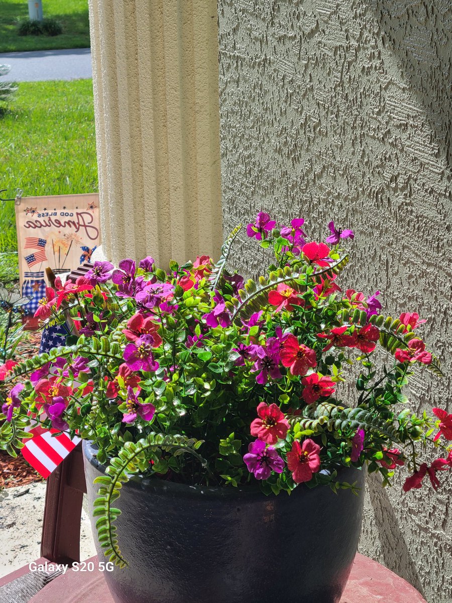 Since we're traveling, I bought artificial flowers for my front entry.  What do you think? No watering required.