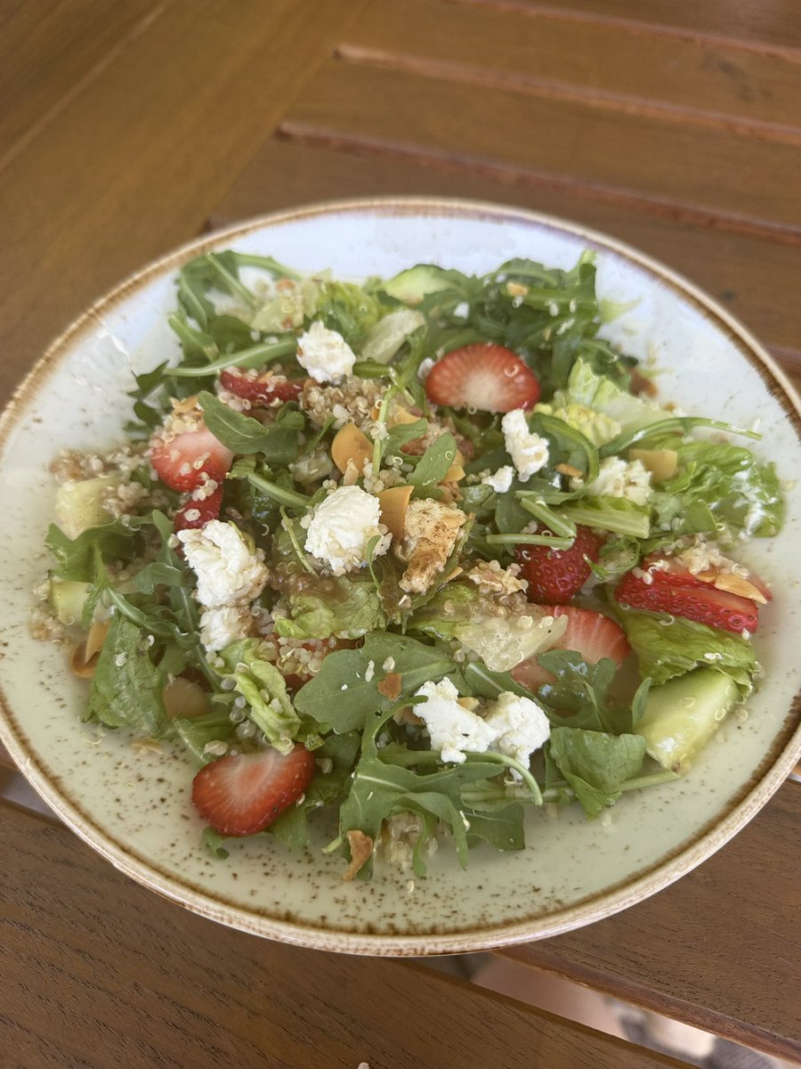 Quinoa, arugula, salad with sliced cucumbers, almonds, fresh strawberries, honey goat cheese crumbles and a delicious vinaigrette dressing! 🍓 🧀 🥗 😘