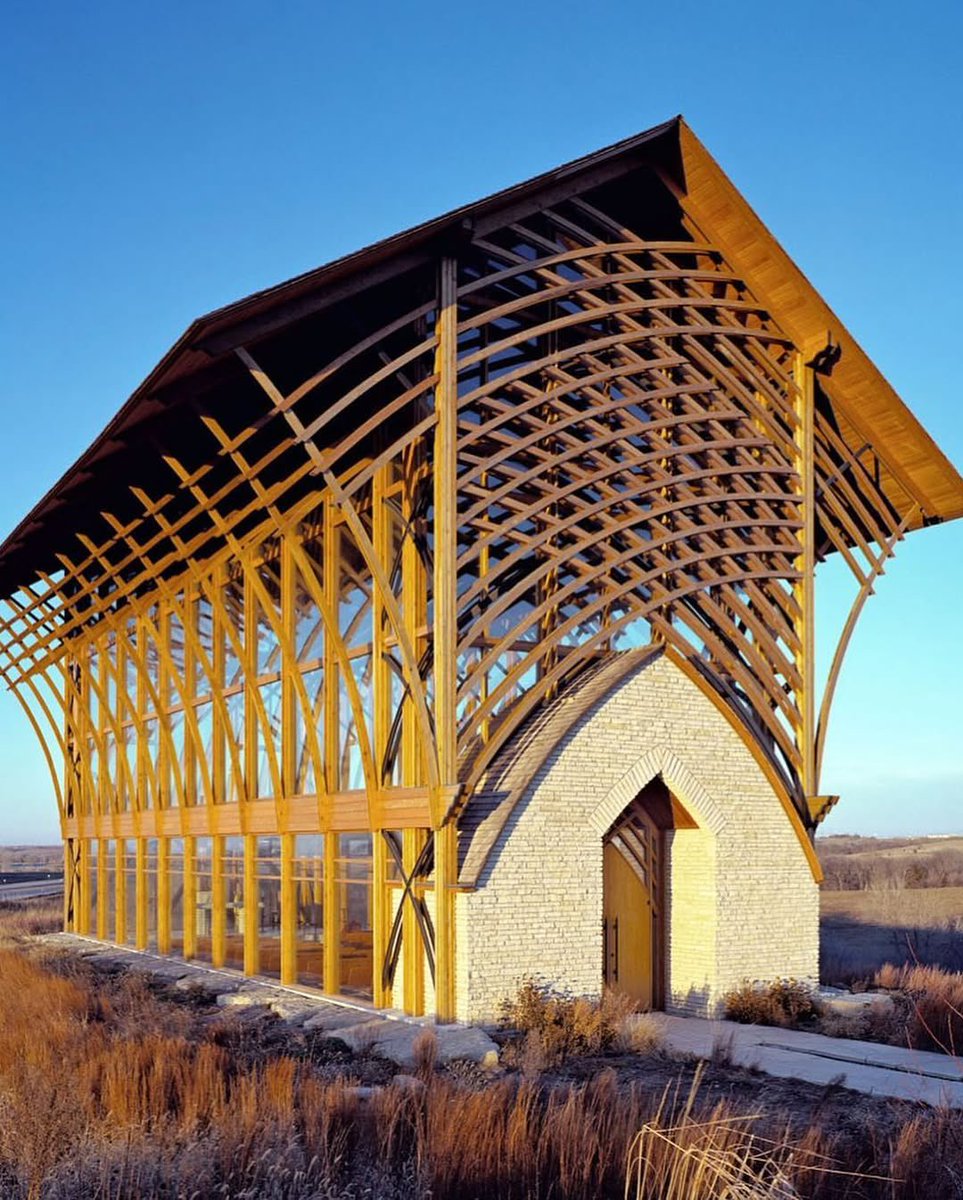 ✝️Located on the hills overlooking the Platte River Valley, the Holy Family Shrine by BCDM Architects is a 45-foot-tall chapel designed as a place for quiet reflection and spiritual focus. Built with arched glue-laminated timber and steel, its exposed structure recalls the