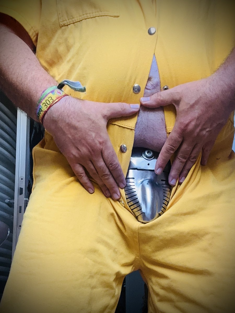 The stripes are gone.
Today, I was handed a yellow jumpsuit—bright, impossible to ignore. A stark contrast to the cold black-and-white of before.

The Carrara belt remains locked tight beneath it, unchanged. But the color shifts everything.