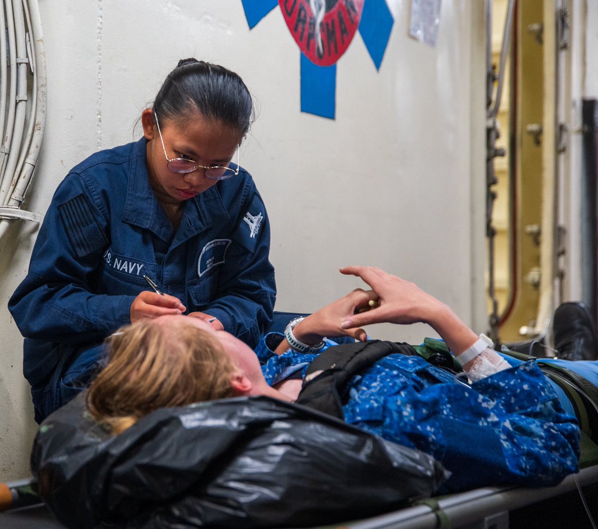 US2ndFleet's tweet image. Sailors assigned to USS New York (LPD 21) and the Rotterdam-class landing platform dock ship HNLMS Johan de Witt (L 801) escort simulated patients while conducting mass casualty training aboard New York during exercise Atlantic Alliance 2025, July 5, 2025. #AA25