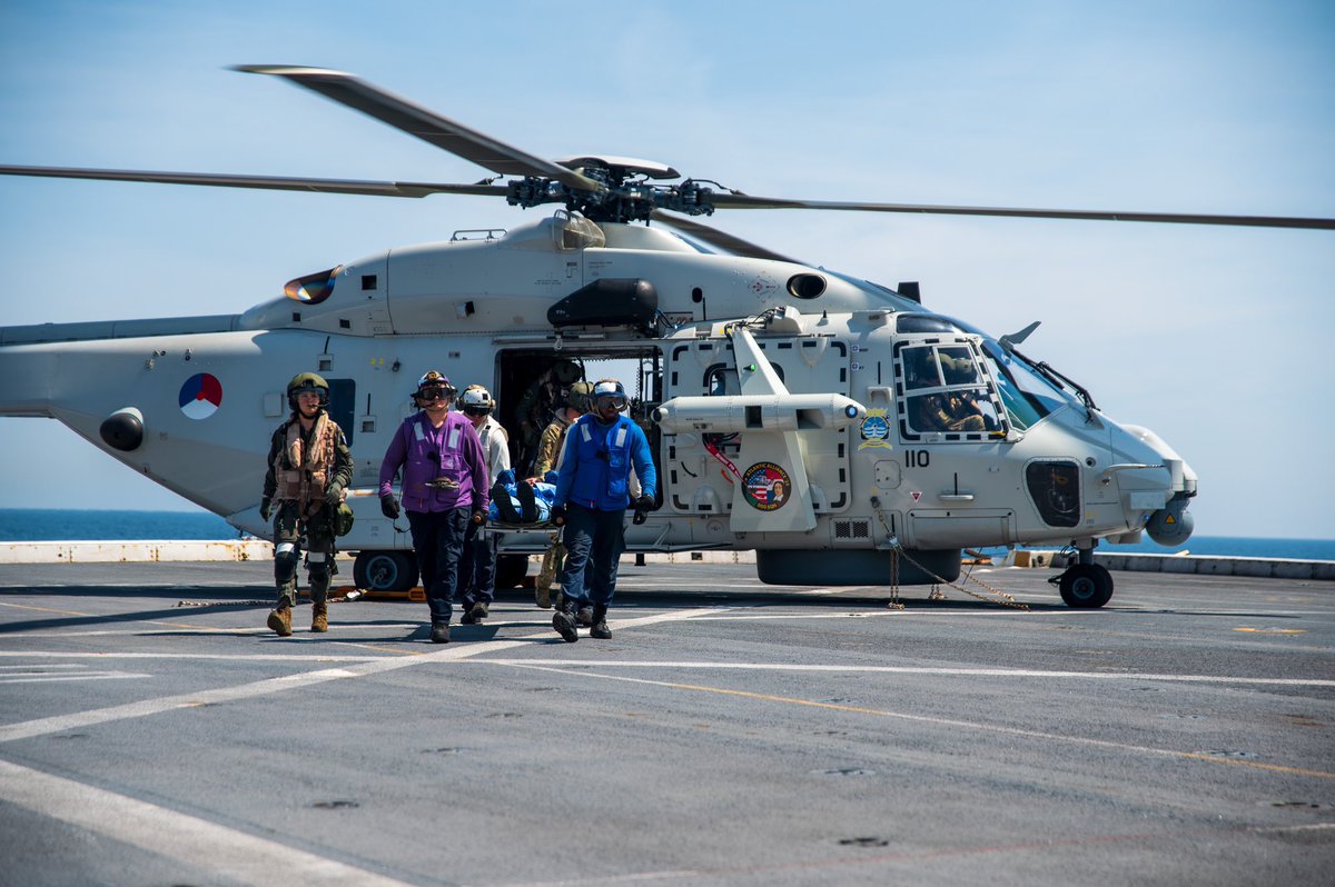 US2ndFleet's tweet image. Sailors assigned to USS New York (LPD 21) and the Rotterdam-class landing platform dock ship HNLMS Johan de Witt (L 801) escort simulated patients while conducting mass casualty training aboard New York during exercise Atlantic Alliance 2025, July 5, 2025. #AA25