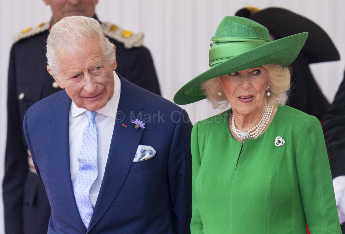 King Charles III &amp; Queen Camilla seem to be checking the time before the formal welcome at the Royal Dais in Windsor for the start of the French State Visit.  #Royals #statevisitfrance