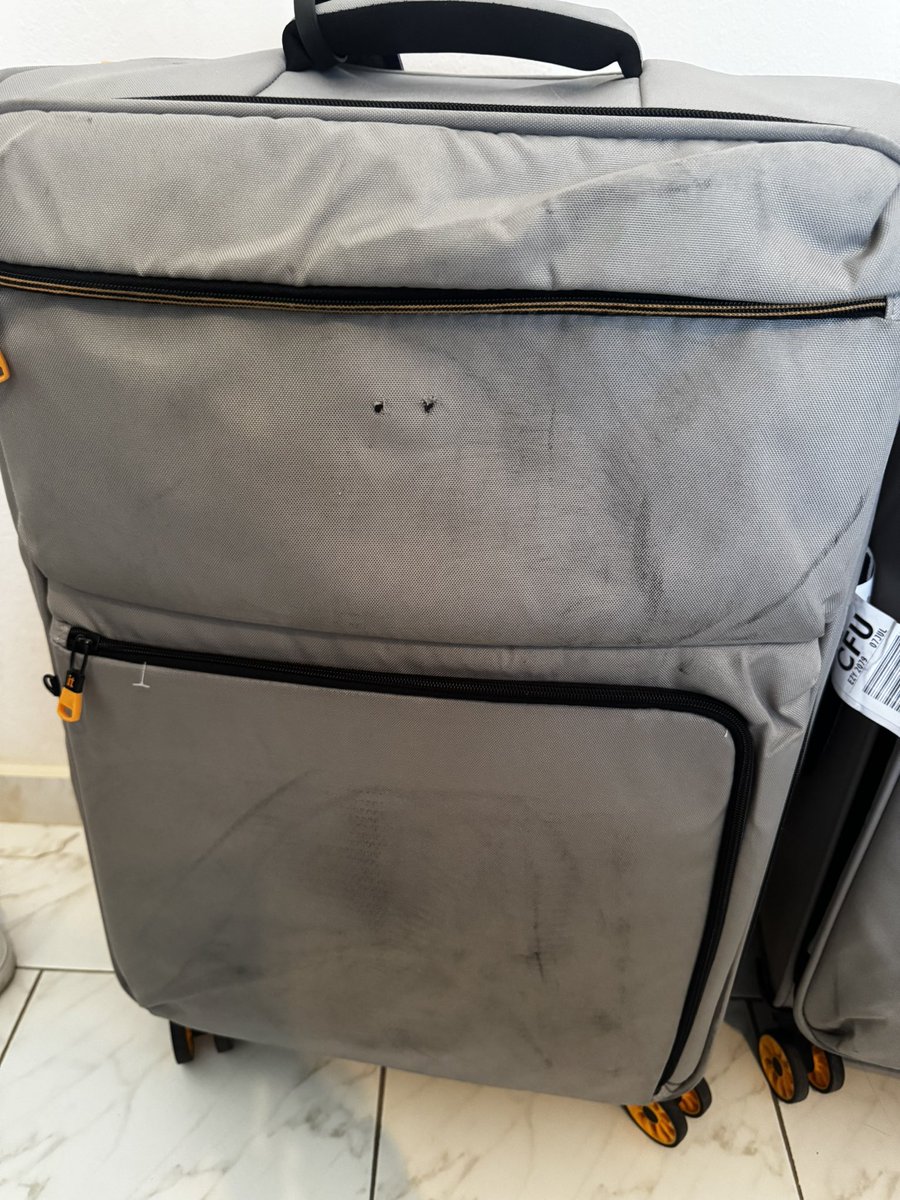 mgrant74's tweet photo. @itluggage after using IT suitcases for a number of years we purchased some replacements this is the condition after using them twice.  Quite clear to me that the plastic logo is a snagging point when going through baggage handling systems and on one case it has been ripped off. https://t.co/eCCKY71Adr