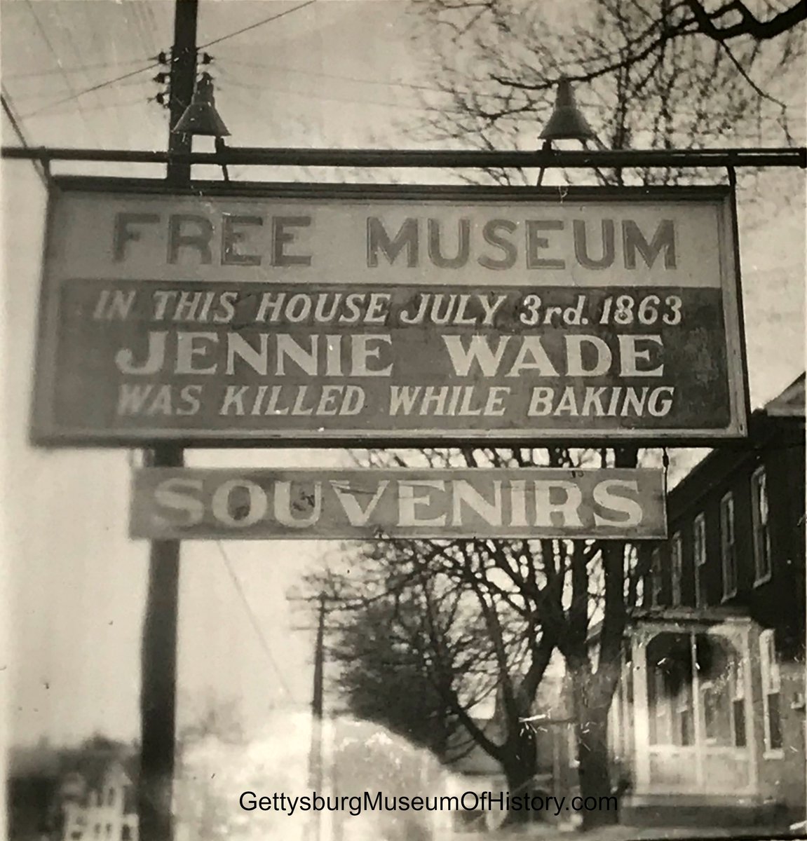 The sign at the Jennie Wade death house Baltimore Street Gettysburg. This view is looking north, note the house on the right now the site of the 1863 Inn. Original unpublished photo 1945 from The Gettysburg Museum Of History archives.
For more on the collections at The Gettysburg