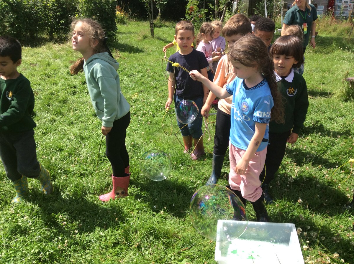 Bubble time for Year 1 today...they have made their own frames and are trying to get bubbles to float over the school!