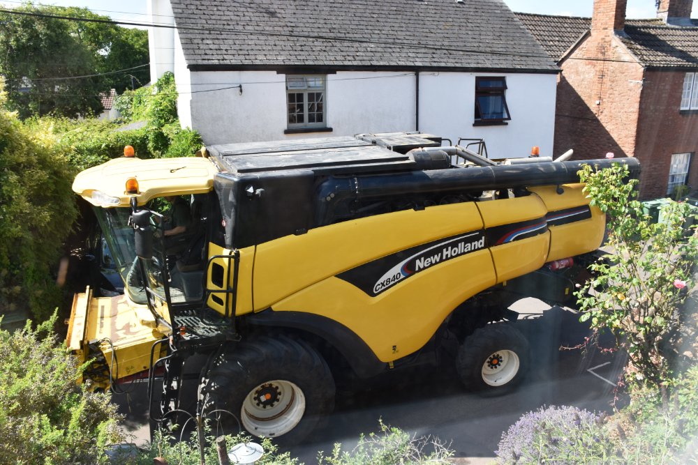 JackMwriter's tweet image. It’s that time of the year again. The street through the village isn’t really wide enough for this, especially with cars parked outside houses. But somehow, they manage to manoeuvre their way through.
#rural #Somerset #village