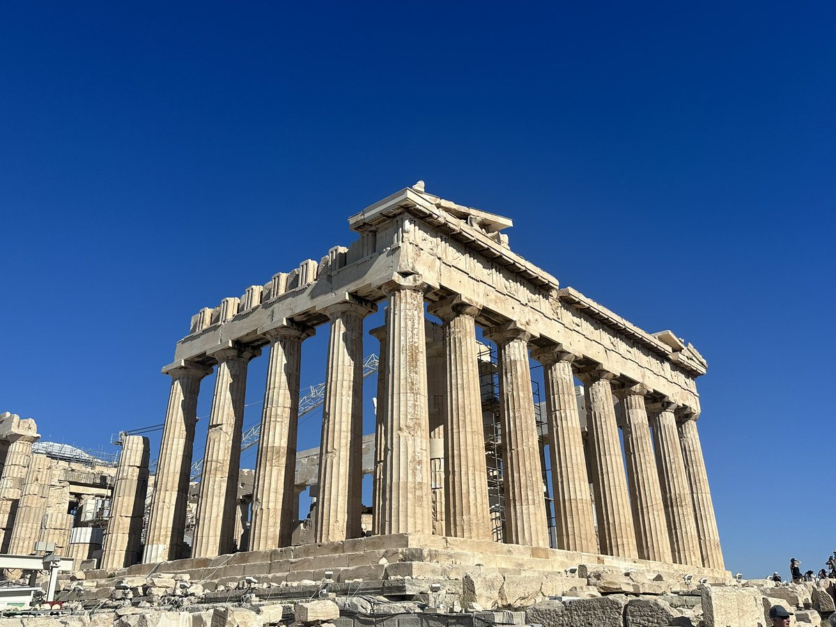 After a recent excavation at the Acropolis archaeologists found early drawings of stick figures indicating the worship of a god named Σαρτοχι (English translation Sartoshi) It is said that he was god of Mfers and loved to FAFO