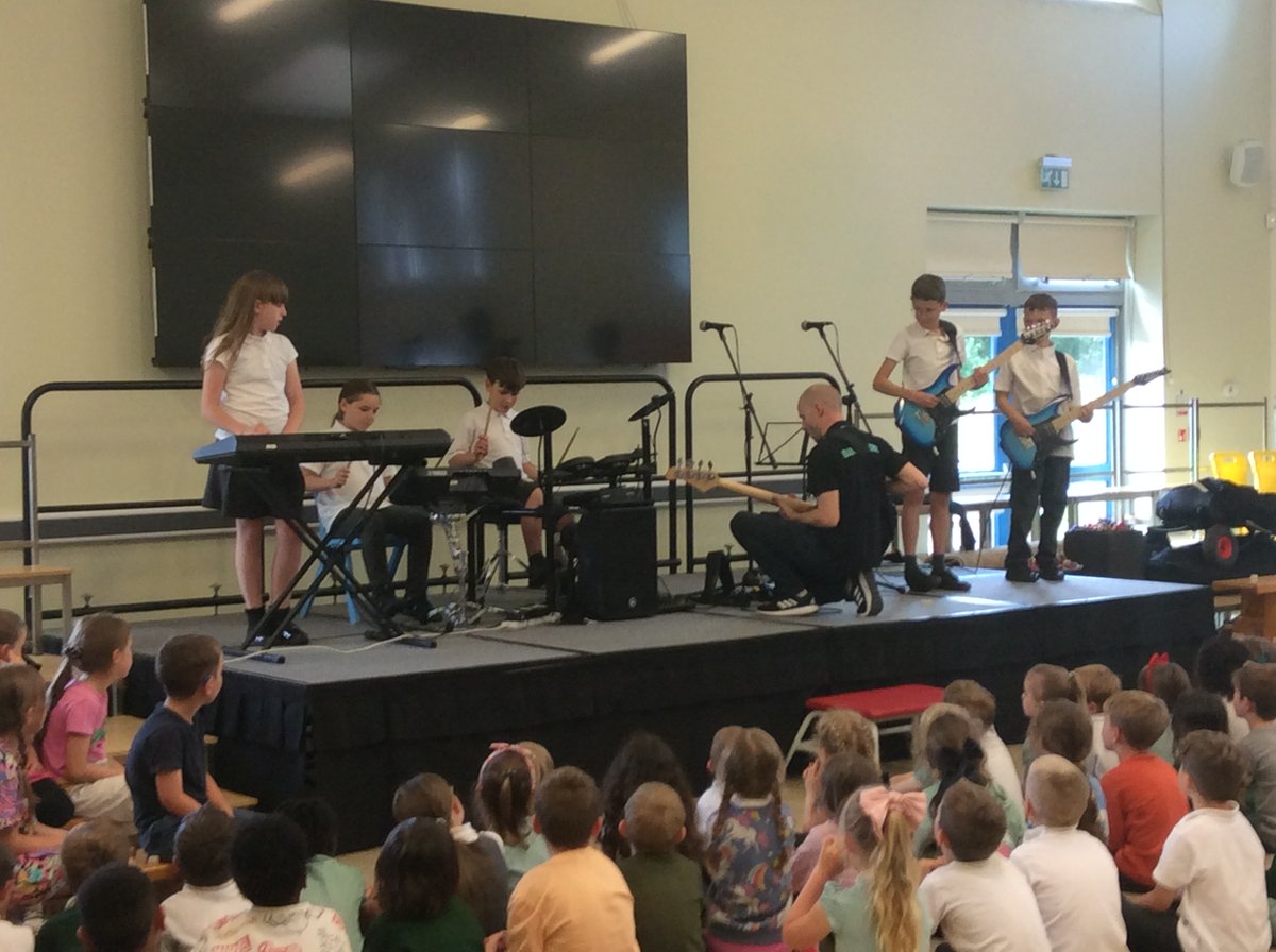 Year 6 rockstars performing on stage today.