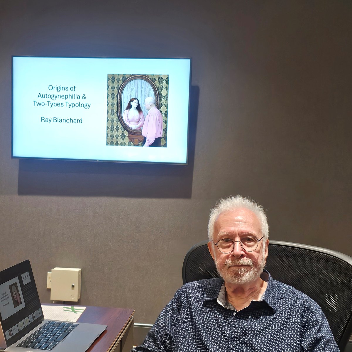BlanchardPhD's tweet image. This is me presenting at a recent meeting of autogynephilia researchers, which was held in Toronto this past June. I just got access to photos taken in the meeting room.