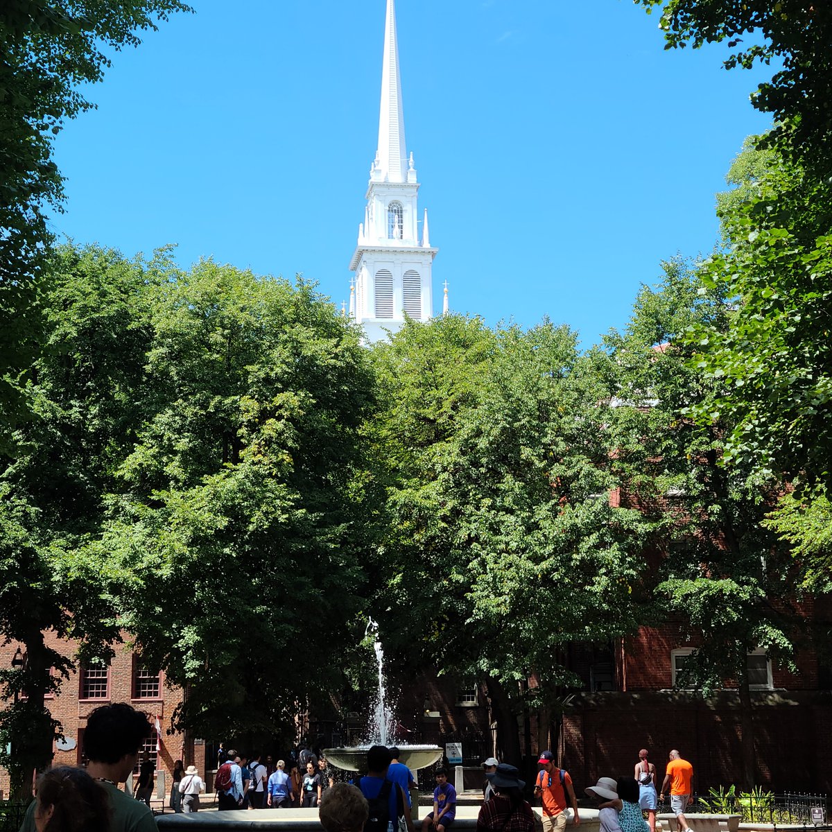 DJWFoundation's tweet image. The steeple of the Old North Church peeking over the trees.