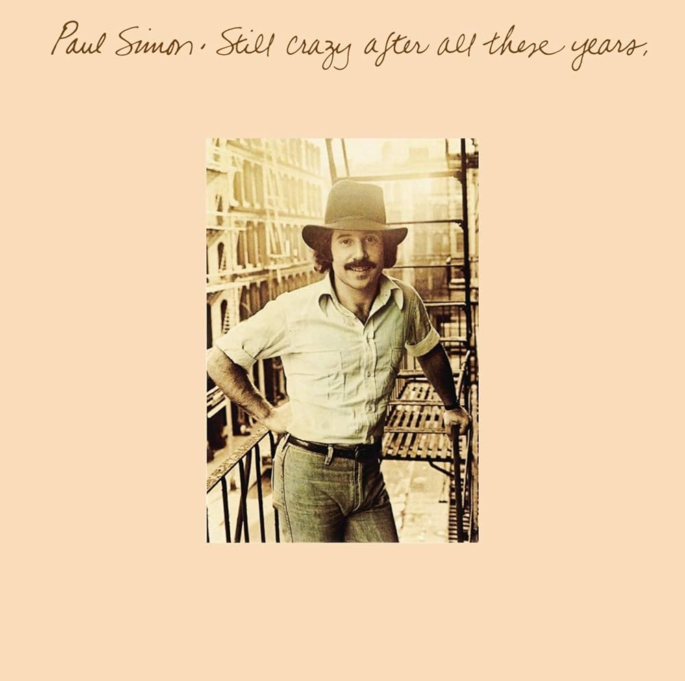 my type is definitely dads and dweebs, specifically paul simon on the cover of his album