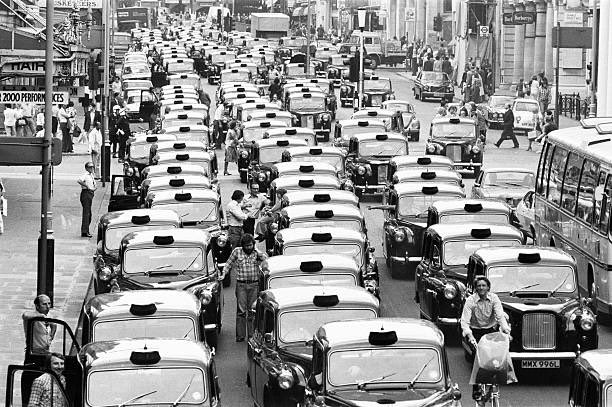 London taxi drivers bring traffic to a standstill as they stage a demonstration in demand of higher wages.