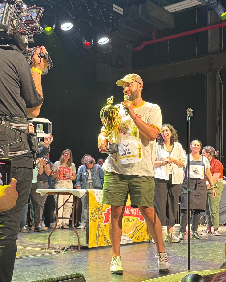 Fine Food Digest editor Mike &amp; marketing officer, Jenna,  jetted to NYC for The Cheesemonger Invitational 🇺🇸 Mike joined the judging panel as top mongers battled it out in cutting, pairing &amp; selling. 

Congrats to winner Max Lazary — see you in Bern for #WorldCheeseAwards! 🧀