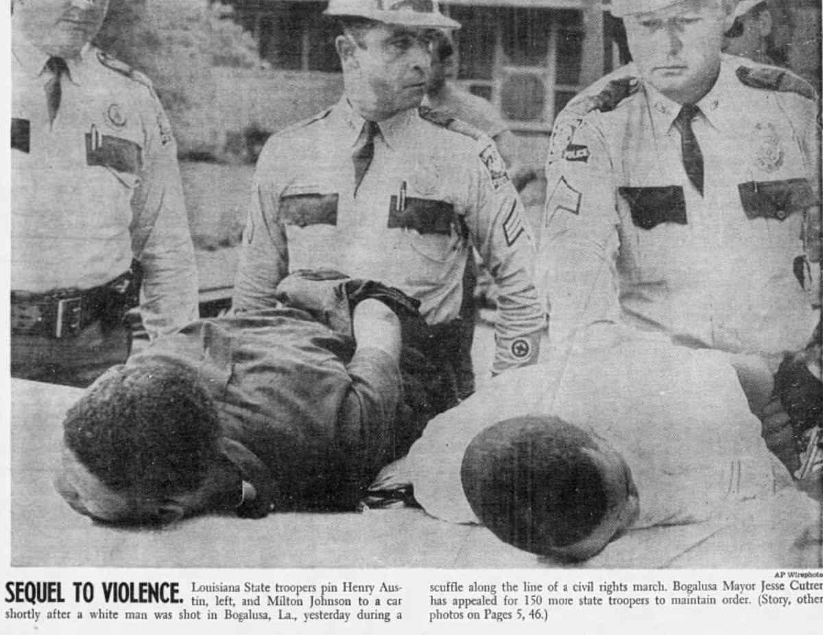 RealTime1960s's tweet photo. July 8, 1965 - A Negro shot and seriously wounded a white man who attacked him today during a civil rights march on a downtown street in Bogalusa, La.
Police Chief Claxton Knight said the Negro was believed to be a member of the Deacons for Defense and Justice, an armed Negro organization formed last spring to defend Negroes against white terrorists.
The white man, Alton Crowe Jr., 25 years old, of Pearl River, La., was rushed to a hospital with two bullet wounds, one in the chest and one in the neck. His condition was listed as critical.
The man who fired the shot, Henry Austin (left), 21, and a second Negro, Milton Johnson (right), 26 — both of Bogalusa — were arrested at the scene and taken to an unidentified town to protect them from angry whites.
A small crowd of whites shouted threats while policemen held the Negroes. Some whites attacked news photographers.
The violence took place after a group of about 250 Negroes had marched peacefully from the Negro district to City Hall. As they passed a shopping plaza on their way back, they were jeered by about 50 whites who shouted insults and obscenities.
Suddenly, a rock sailed out of the plaza and struck Anna Mae Wills, 17, of Bogalusa, a Negro girl. She fell to the ground, screaming and bleeding from the nose, and a nurse with the civil rights medical committee rushed to her aid.
As the nurse helped the girl toward a car, three white men followed them. The whites began pounding on the car and swinging at the two Negroes inside.
Three shots rang out from inside the car, and Crowe staggered away a few steps and then slumped to the pavement.
State police quickly surrounded the wounded man and the auto as other whites rushed up. One woman screamed hysterically, “Kill them, kill them.”
Austin and Johnson were booked on charges of investigation of aggravated battery. Though a felony, it is a less serious charge than attempted homicide.

Support this project at https://t.co/bGfYsoNfMs